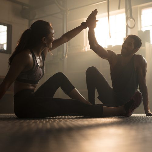 friends working out at gym perfectly after taking ManTFup supplements
